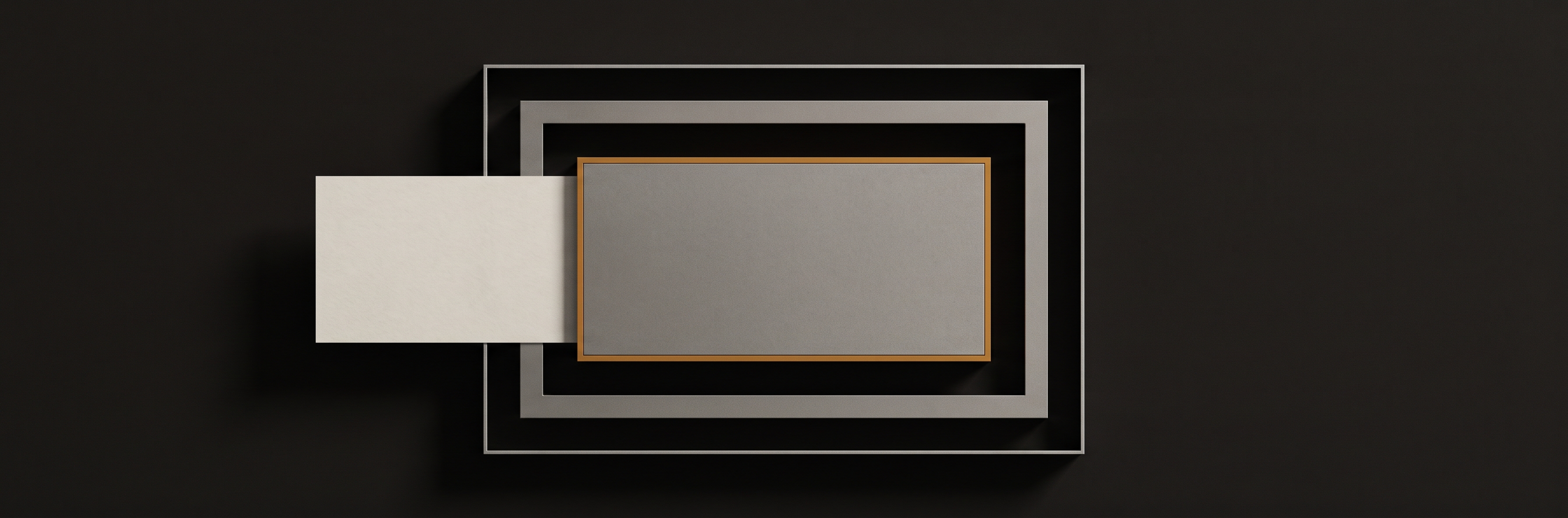 Three nested rectangular frames of decreasing size on a dark surface, the innermost a solid steel plate.